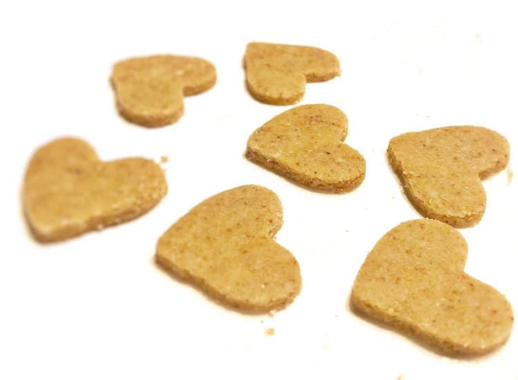 heart-shaped toasted almond cookies ready for oven