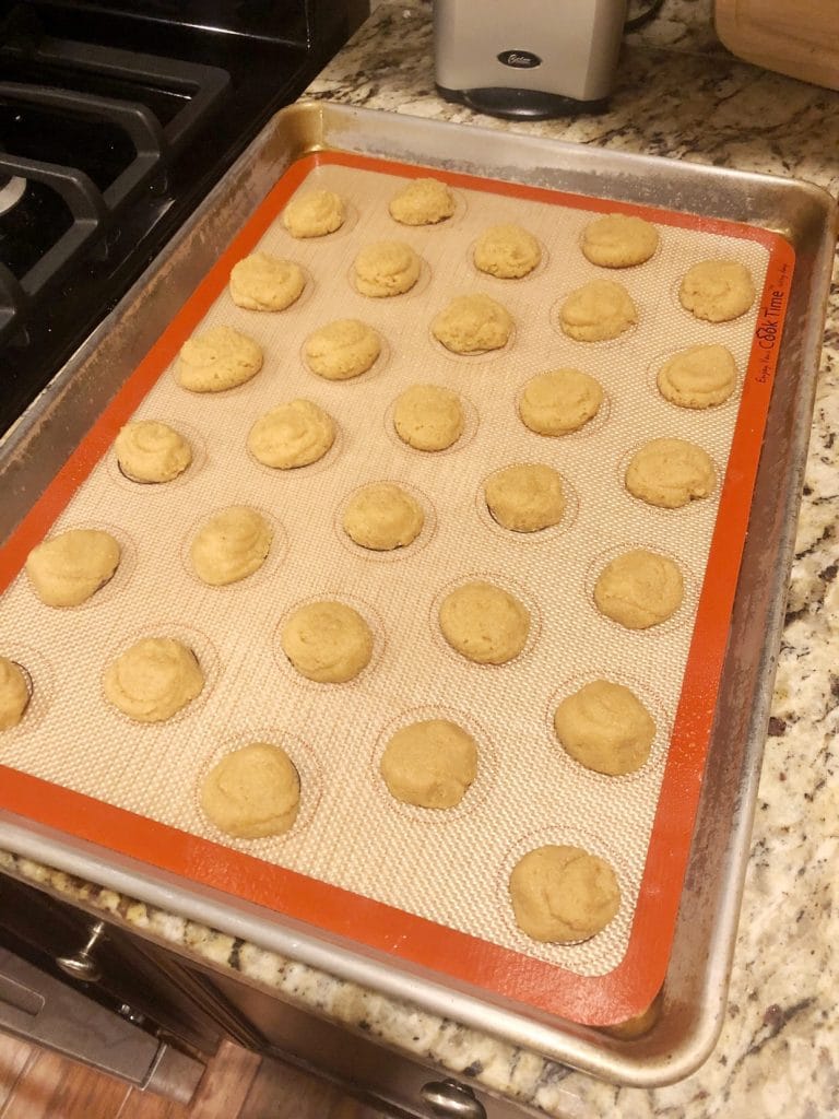 macarons on a baking sheet ready to go in the oven