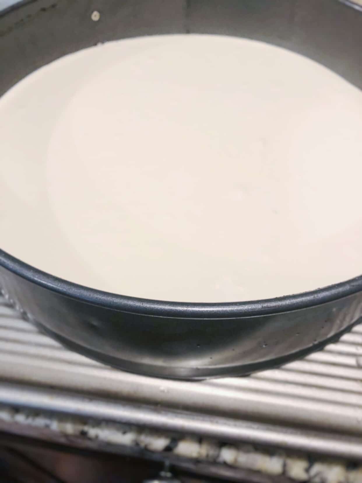 close-up of brownie cheesecake ready to go in oven