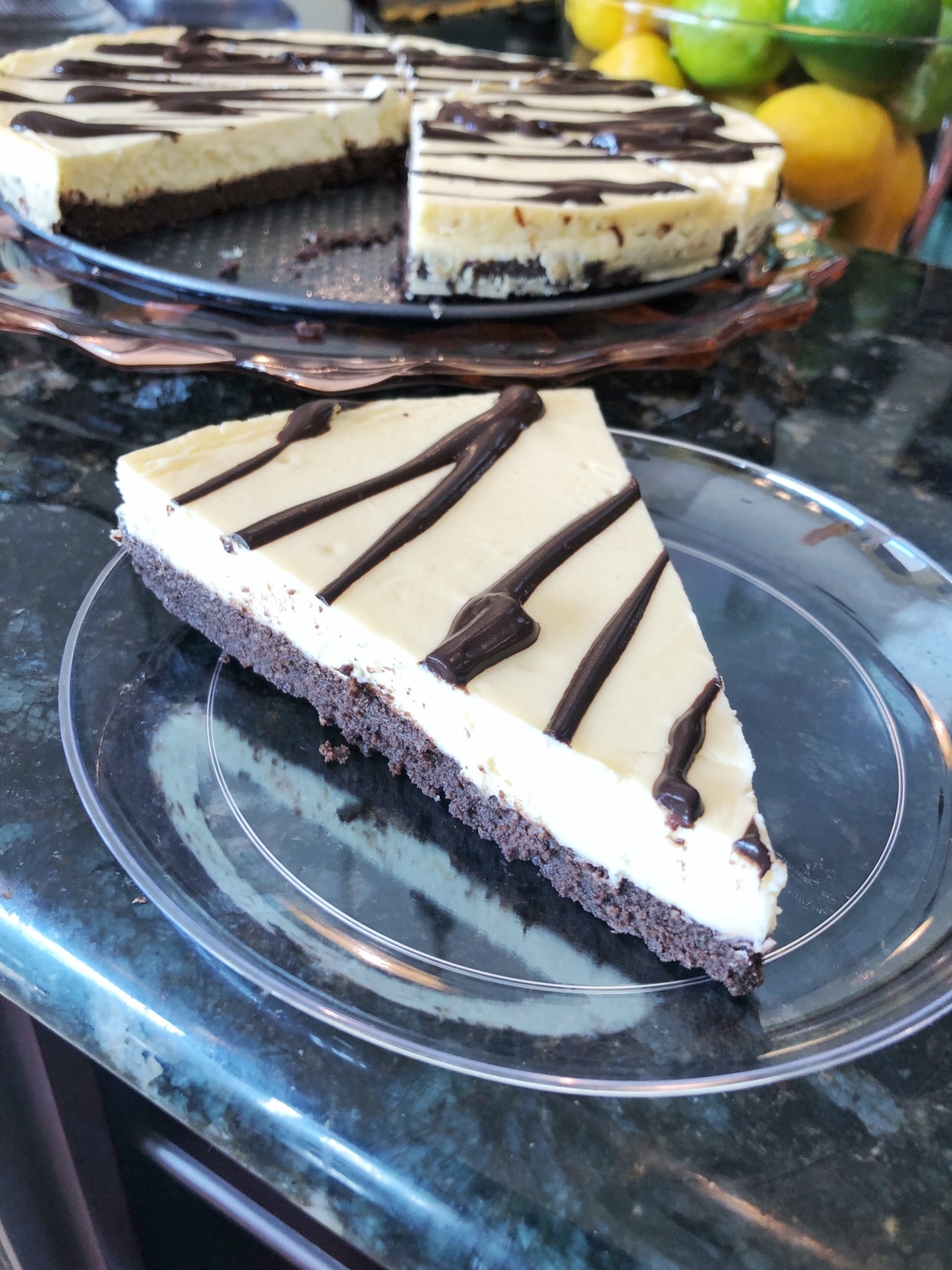 slice of brownie cheesecake on plastic plate