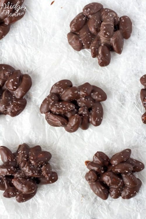 chocolate clusters with almonds on a baking sheet