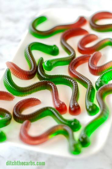 gummy worm candy red and green on a white plate