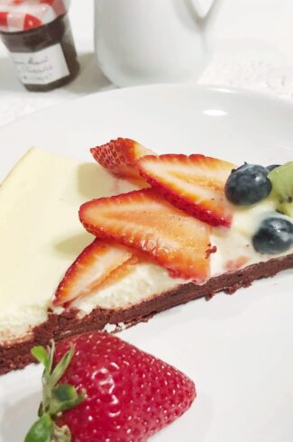 side view of single slice Red Velvet Brownie Cheesecake