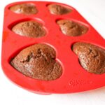 Keto Chocolate Flaxseed Muffins in red heart silicone baking pan side view