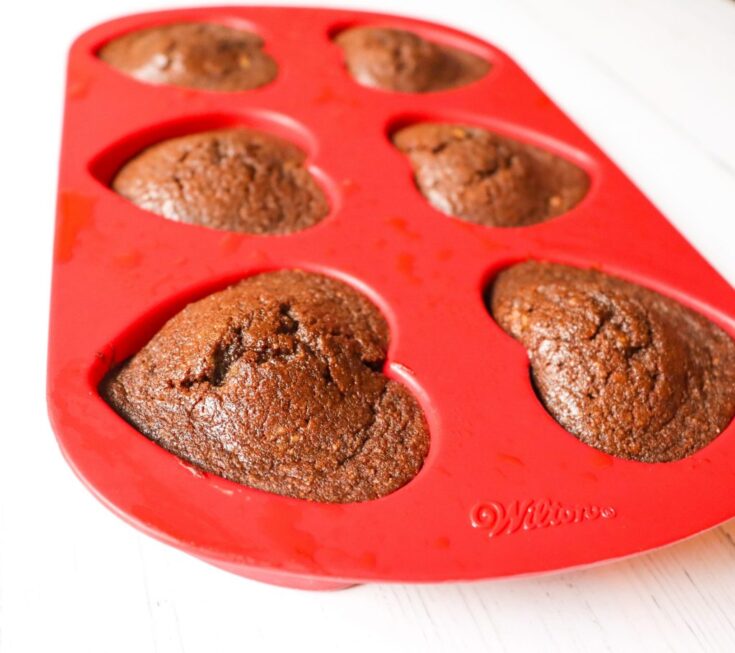Keto Chocolate Flaxseed Muffins in red heart silicone baking pan side view