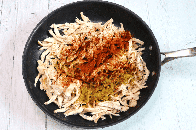 Shredded chicken with seasoning on top