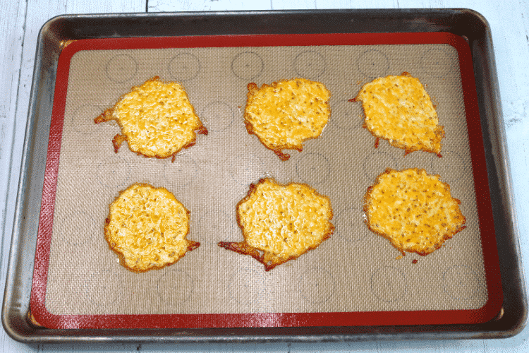 Baked cheese mounds on baking mat fresh from the oven