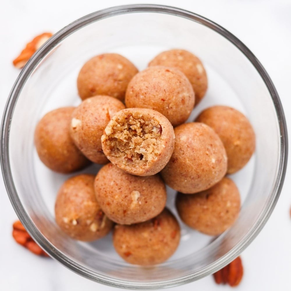 stacked keto fat bombs in a glass bowl