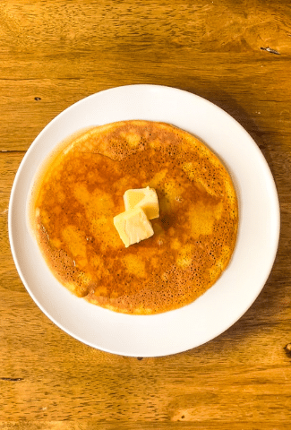 Keto Pancakes on white plate on brown table