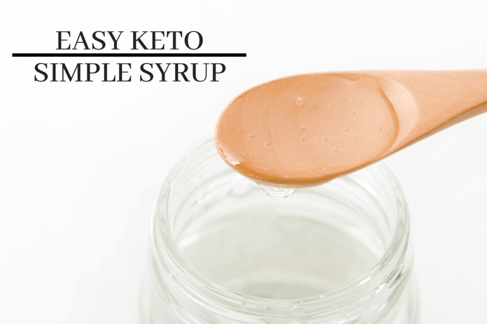 easy keto simple syrup in a glass jar with wooden spoon