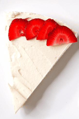 Keto No-Bake Cheesecake with sliced strawberries closeup featured image