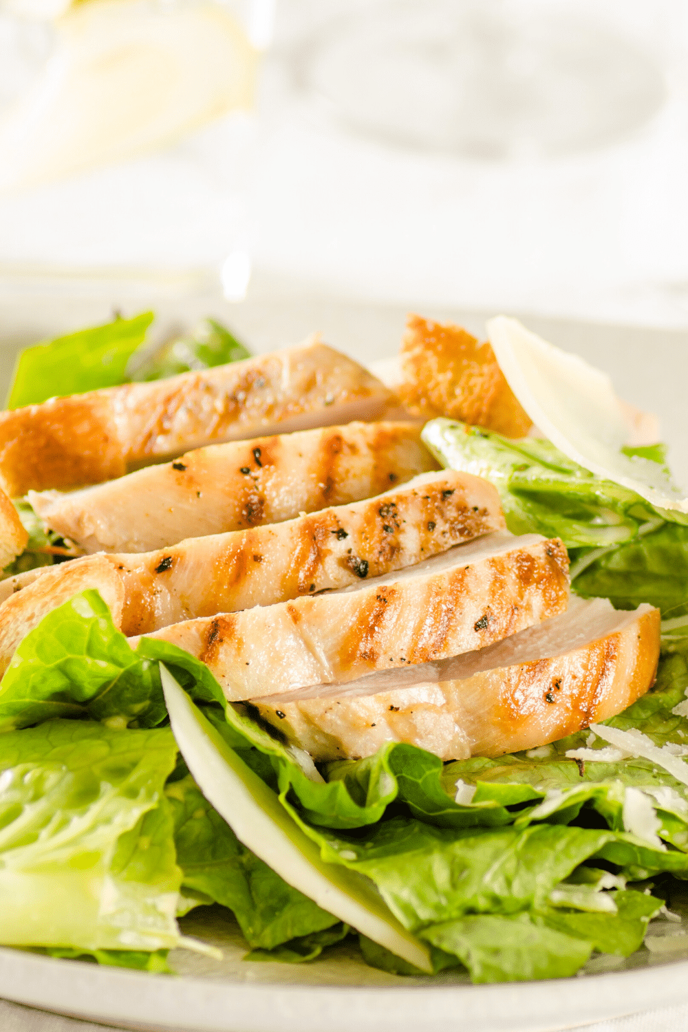 A classic Caesar salad made keto-friendly with chopped Romaine lettuce, Parmesan cheese, Cello Whisps, and creamy Caesar dressing.