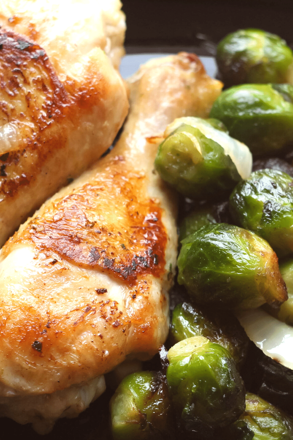 Roasted Chicken and Brussels Sprouts, a comforting and savory dish featuring tender roasted chicken pieces and caramelized Brussels sprouts. The chicken is seasoned with a blend of herbs and spices, resulting in juicy and flavorful meat. Accompanying the chicken are Brussels sprouts, roasted until golden brown and slightly crispy, imparting a delicious nutty flavor. This hearty and satisfying combination of roasted chicken and Brussels sprouts offers a delightful contrast of textures and flavors, making it a perfect choice for a wholesome and flavorful meal