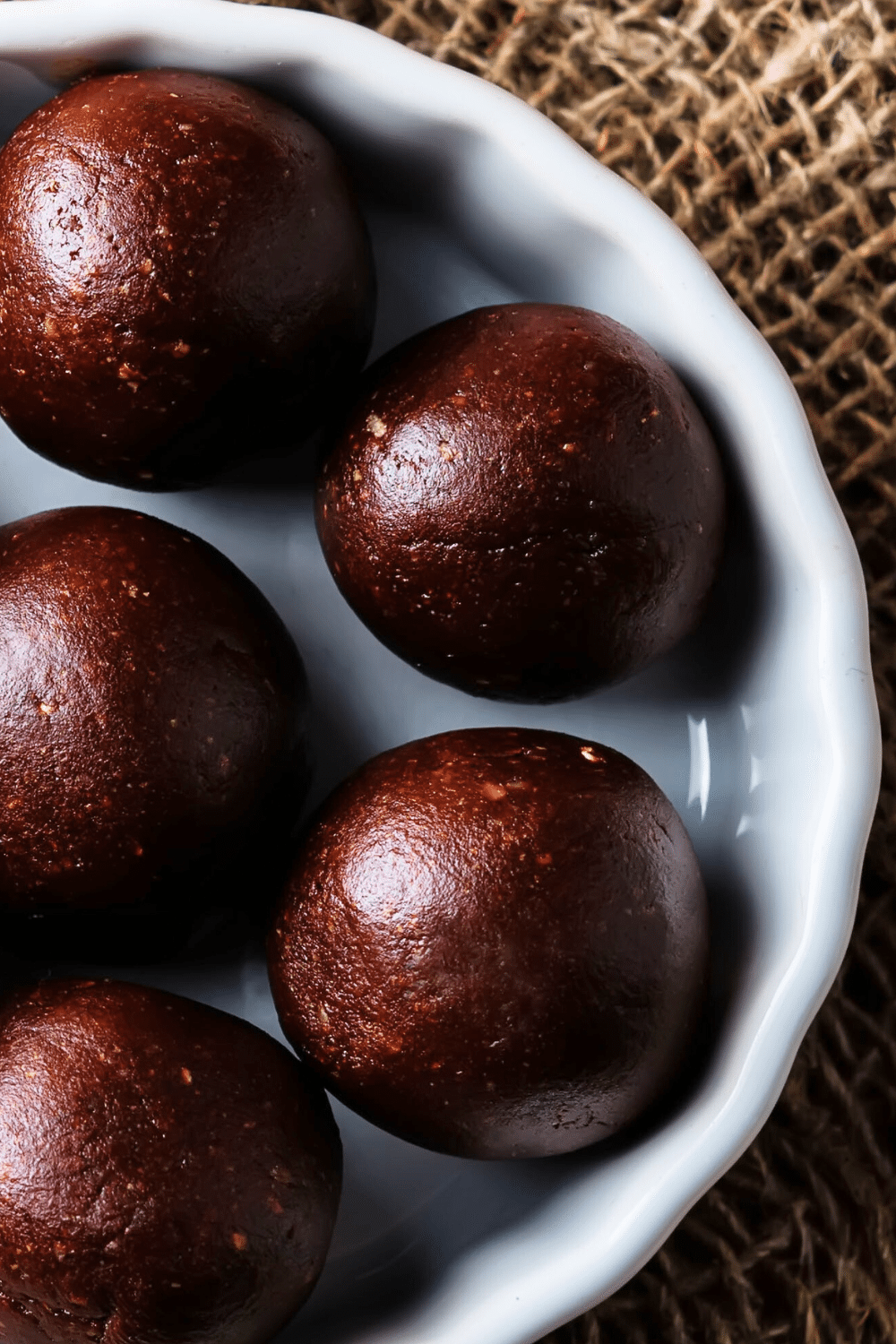 A delightful assortment of keto brownie fat bombs, artfully arranged in a group, showcasing their decadent appearance.