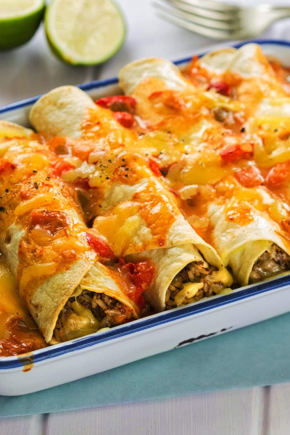 Savory beef enchiladas wrapped in low-carb tortillas, showcasing a delectable fusion of flavors. The tender beef filling is seasoned to perfection and encased in these specialized wraps. Topped with a rich, zesty sauce and a sprinkle of melted cheese, these enchiladas offer all the traditional taste and comfort, while remaining mindful of a low-carb approach.
