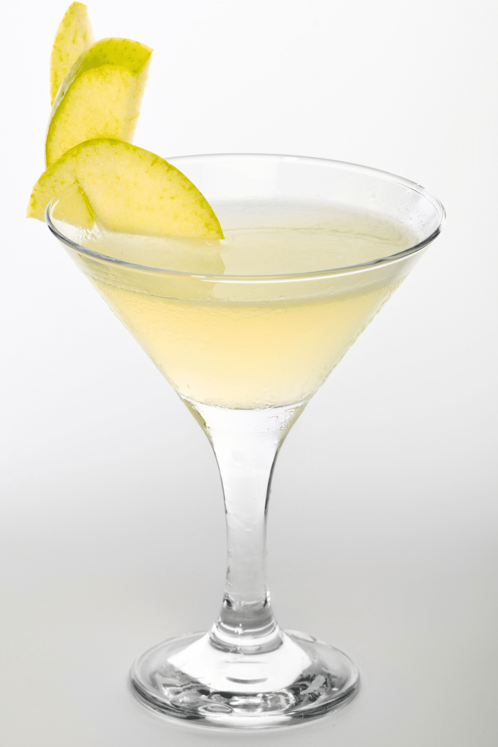 Sophisticated martini cocktail garnished with three green olives, showcasing gin or vodka, and a hint of dry vermouth.