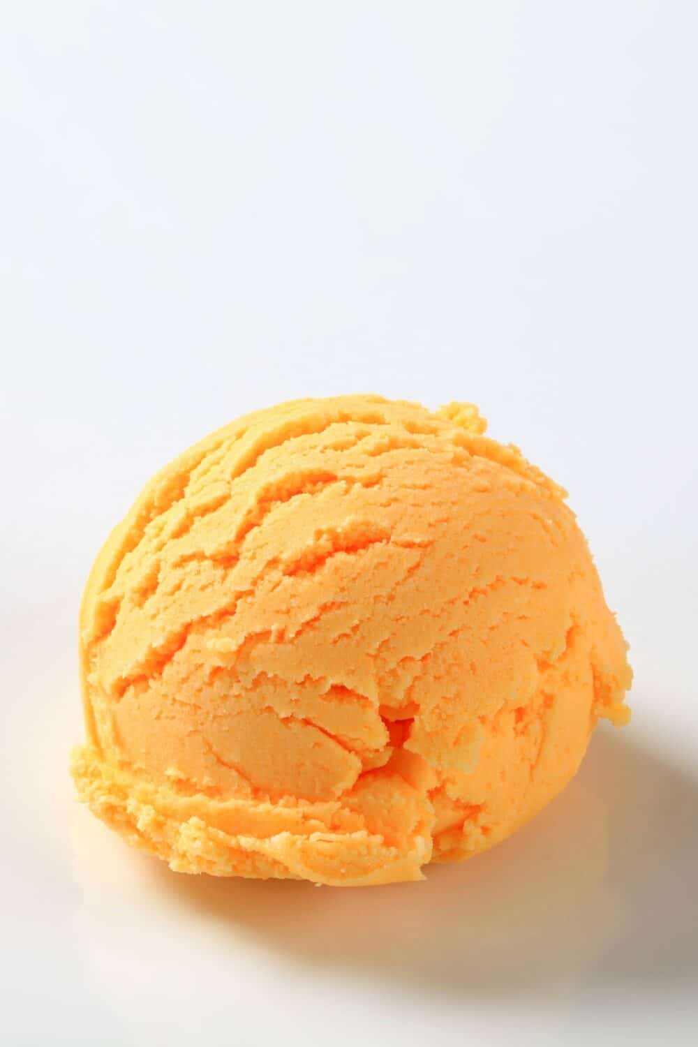 a creamy scoop of orange Rebel Ice Cream