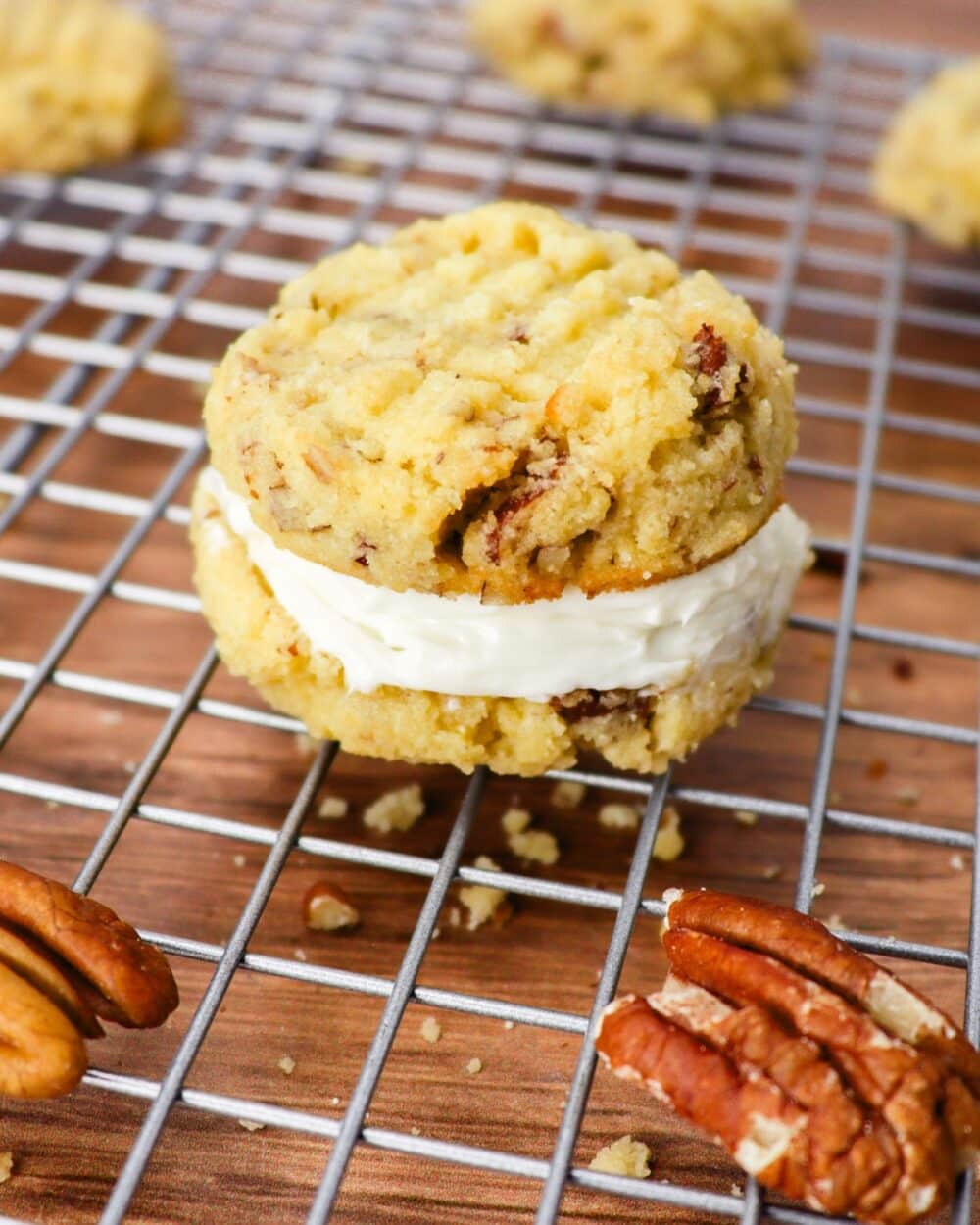 These Keto Pecan Cookies With Cream Cheese Filling are a sandwich-type cookie with a rich, nutty base and a luscious cream cheese filling. You'll want to make this warm, toasty, classic cookie with a twist for the Holidays this year. Each bite offers a delightful blend of buttery pecans and smooth, creamy center. I created a drop cookie version instead of traditional shortbread because I think it pairs better with the cream cheese. The cookies taste delicious on their own, but even better when sandwiched with the 2-ingredient cream cheese filling.