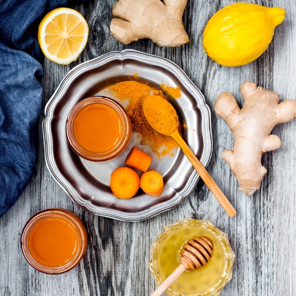 carrot ginger immune boosting anti inflammatory smoothie with turmeric and honey, detox morning juice drink, clean eating