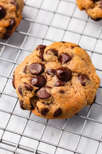 chocolate chip protein cookies on a wire cooling rack