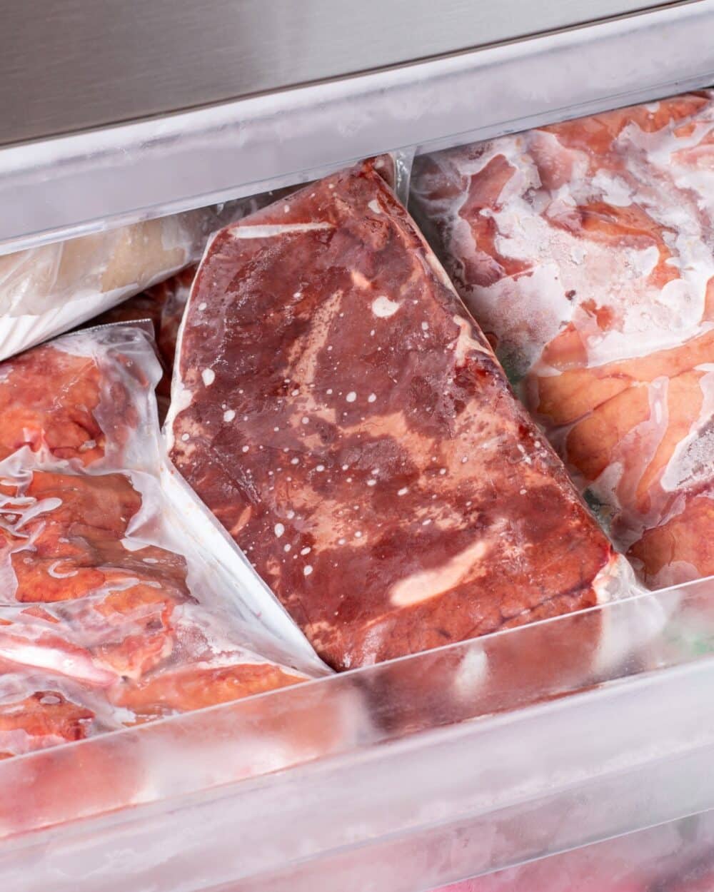 meat in a freezer in freezer bags