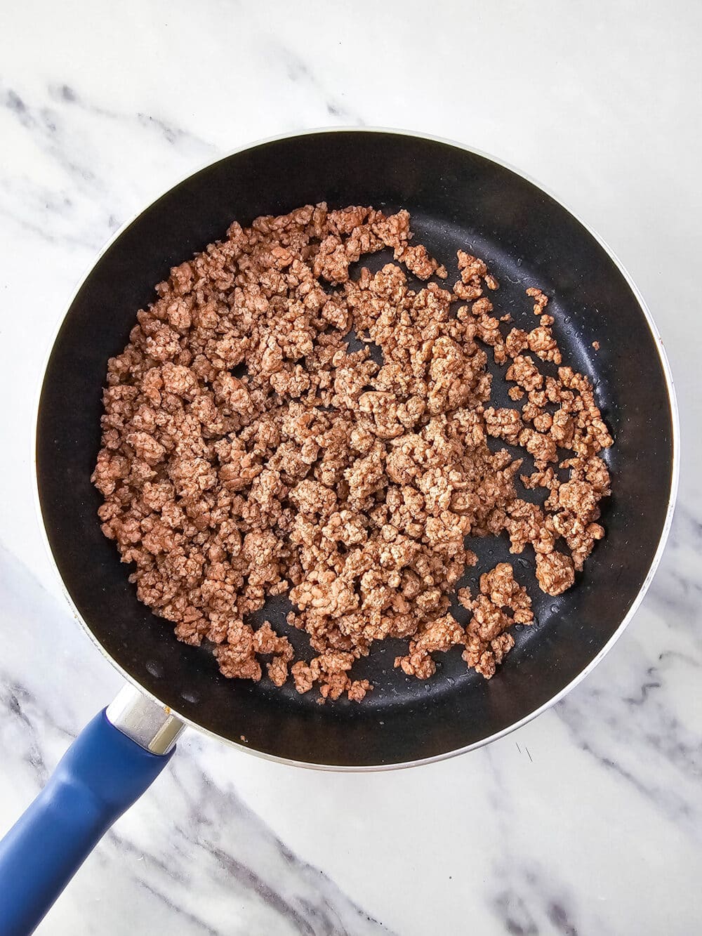 cooked ground beef in a pan