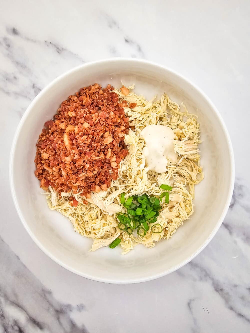 bowl of ingredients for Keto Chicken Bacon Ranch Bites