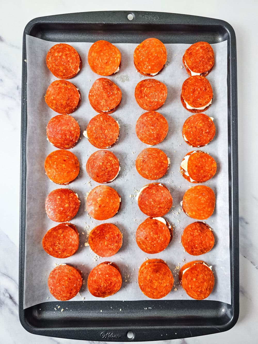 ready for oven Keto Pepperoni Cream Cheese Bites on baking sheet