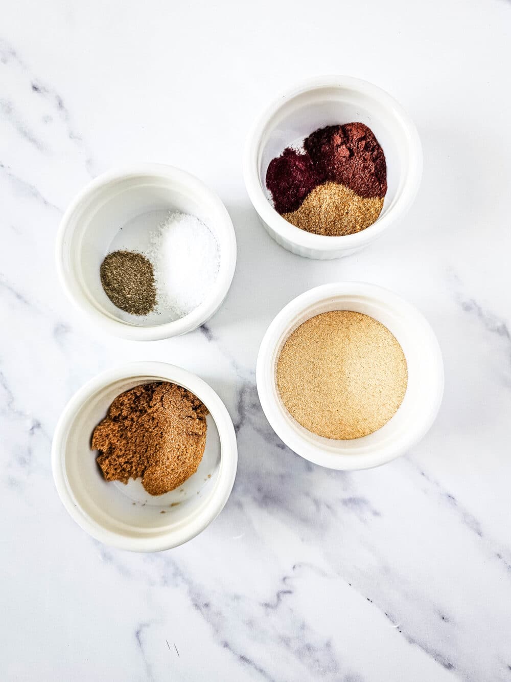 ingredients in separate bowls for keto steak taco seasoning