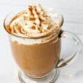 protein coffee with whipped cream topping and spices side view