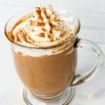 protein coffee with whipped cream topping and spices side view