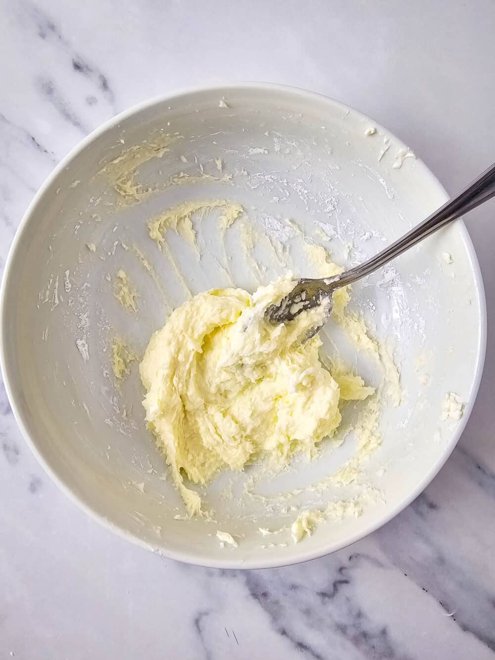mixed cream cheese and sweetener in a bowl