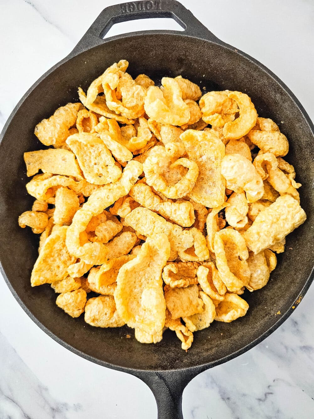 pork rinds in iron skillet