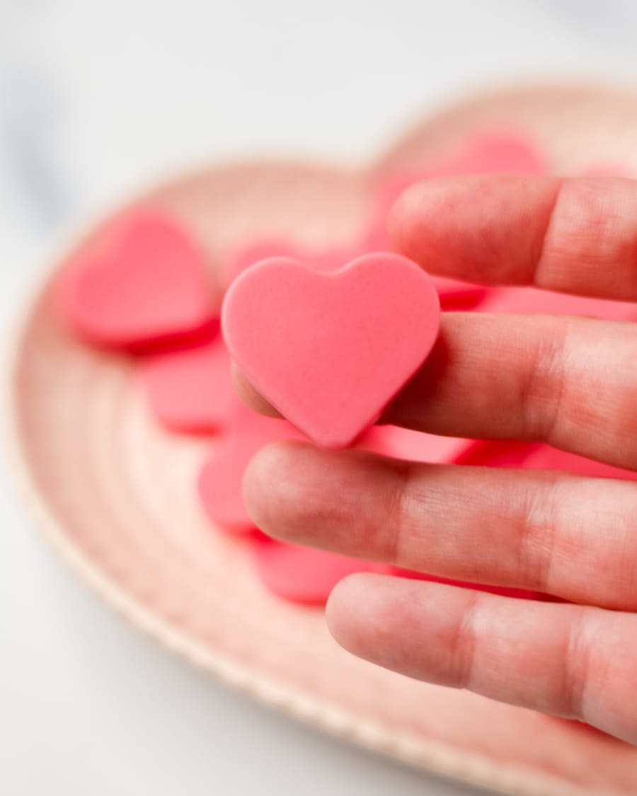 holding Keto Strawberry Gummy bear in hand