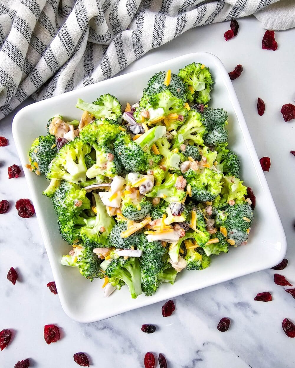 Low Carb Broccoli Salad in a bowl with cranberries scattered
