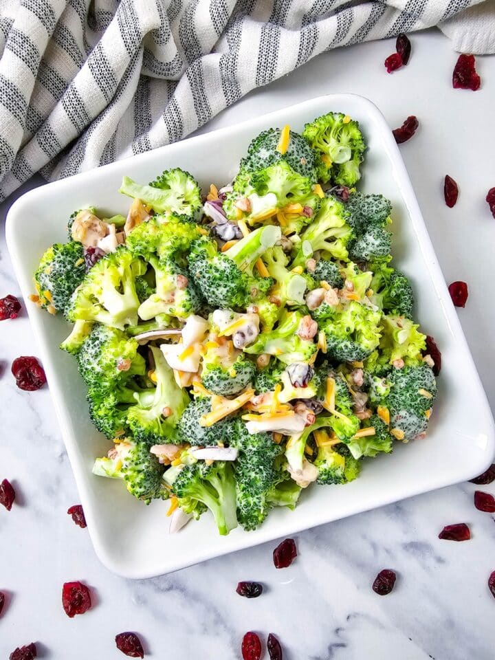 Low Carb Broccoli Salad in a bowl with cranberries scattered
