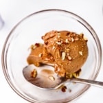 close-up of chocolate protein ice cream topped with walnuts