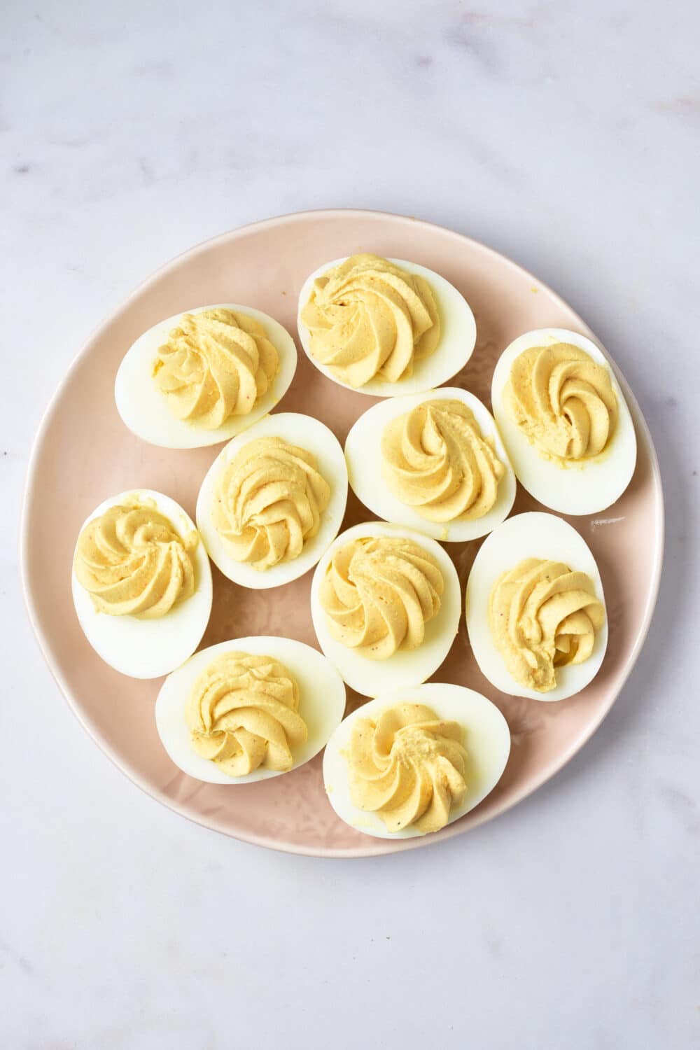 deviled eggs piped on ready for toppings