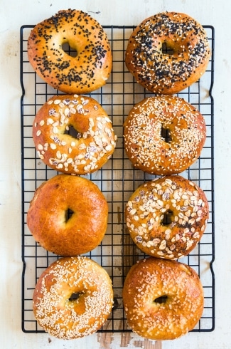 assorted cottage cheese bagels on a cooling rack