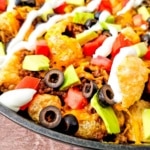 Keto Pork Rind Nachos in iron skillet closeup