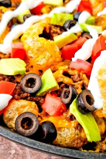 Keto Pork Rind Nachos in iron skillet closeup