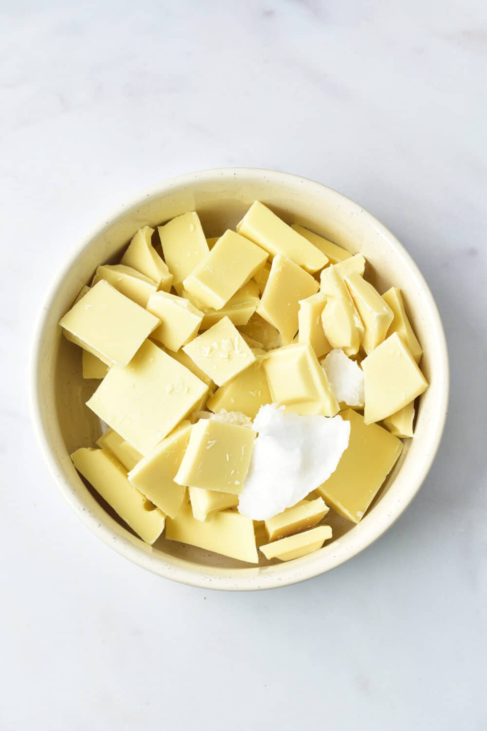 white chocolate pieces and coconut oil in a bowl