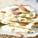 White Chocolate Almond Bark stacked on a cutting board