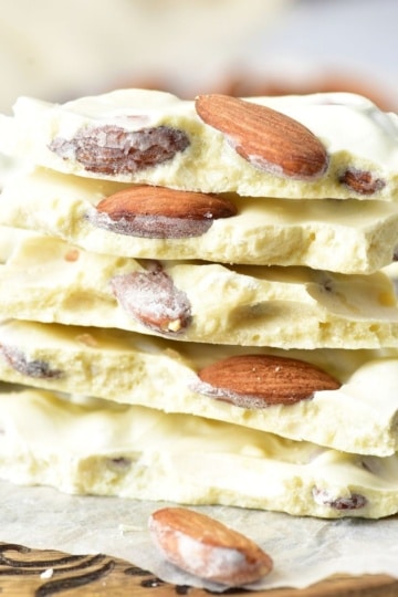 White Chocolate Almond Bark stacked on a cutting board