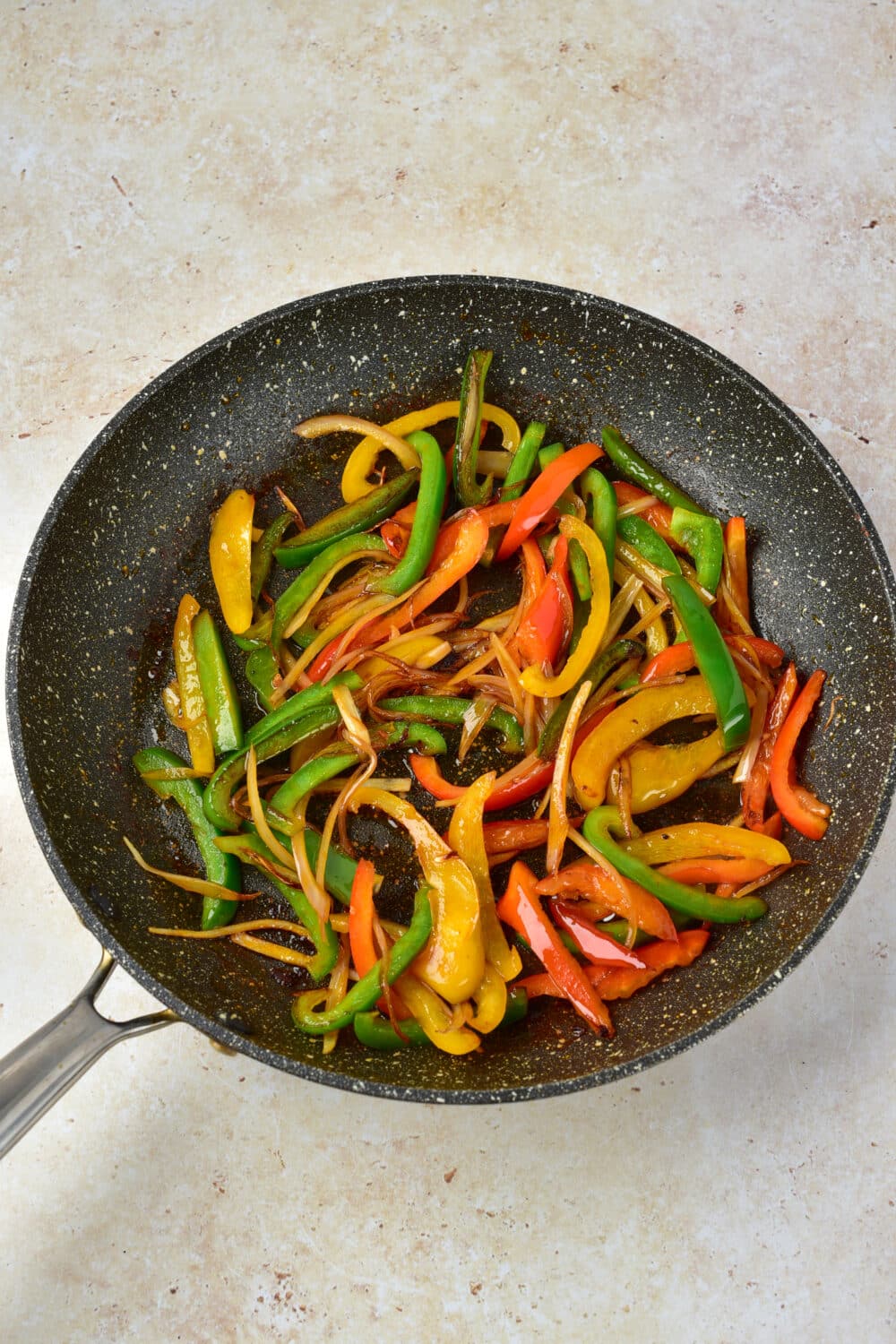 cooked sliced vegetables in a pan