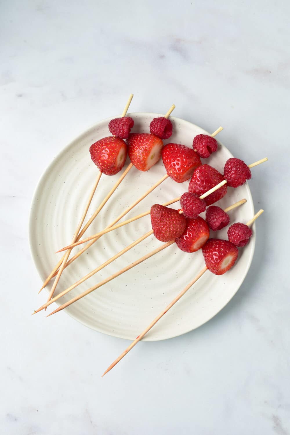 raspberries and strawberries on skewer