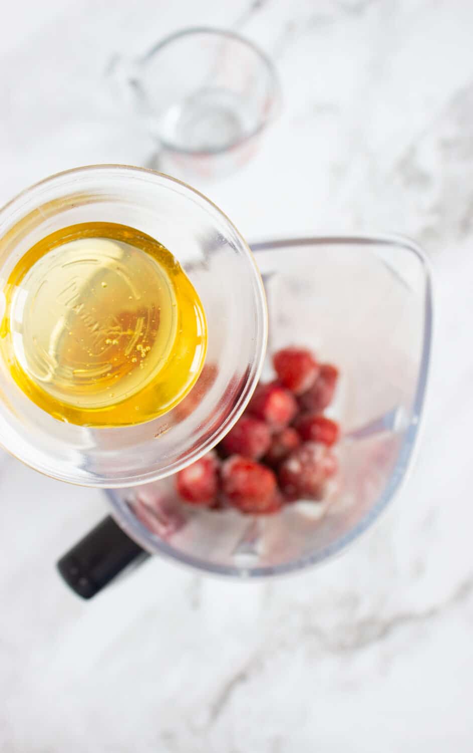 strawberries and sugar-free honey in a blender