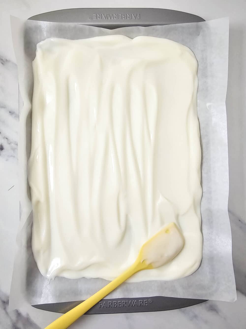 greek yogurt spread out thin on a baking pan