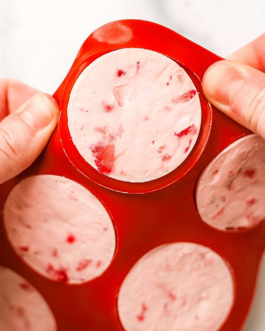popping out Keto Strawberry Ice Cream Bites from silicone mold