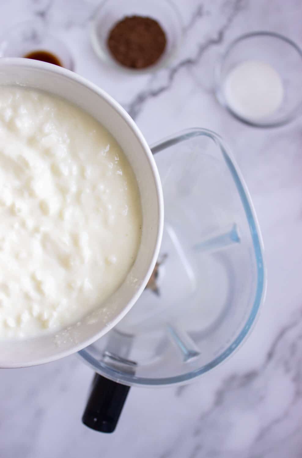 adding cottage cheese to a blender